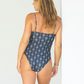Sustainable swimwear black and white pattern one piece swimsuit with high cut leg and full coverage back view