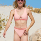 Sustainable swimwear reversible bikini in blush and peach cheeky bikini bottom on monique
