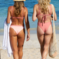 Sustainable swimwear reversible bikini in blush and peach cheeky bikini bottom twin back view