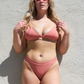 Sustainable swimwear reversible bikini top in blush and peach on Jess