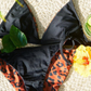 Sustainable swimwear reversible bikini top in black and leopard print flat lay