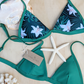 Sustainable swimwear reversible bikini top in green floral print flat lay