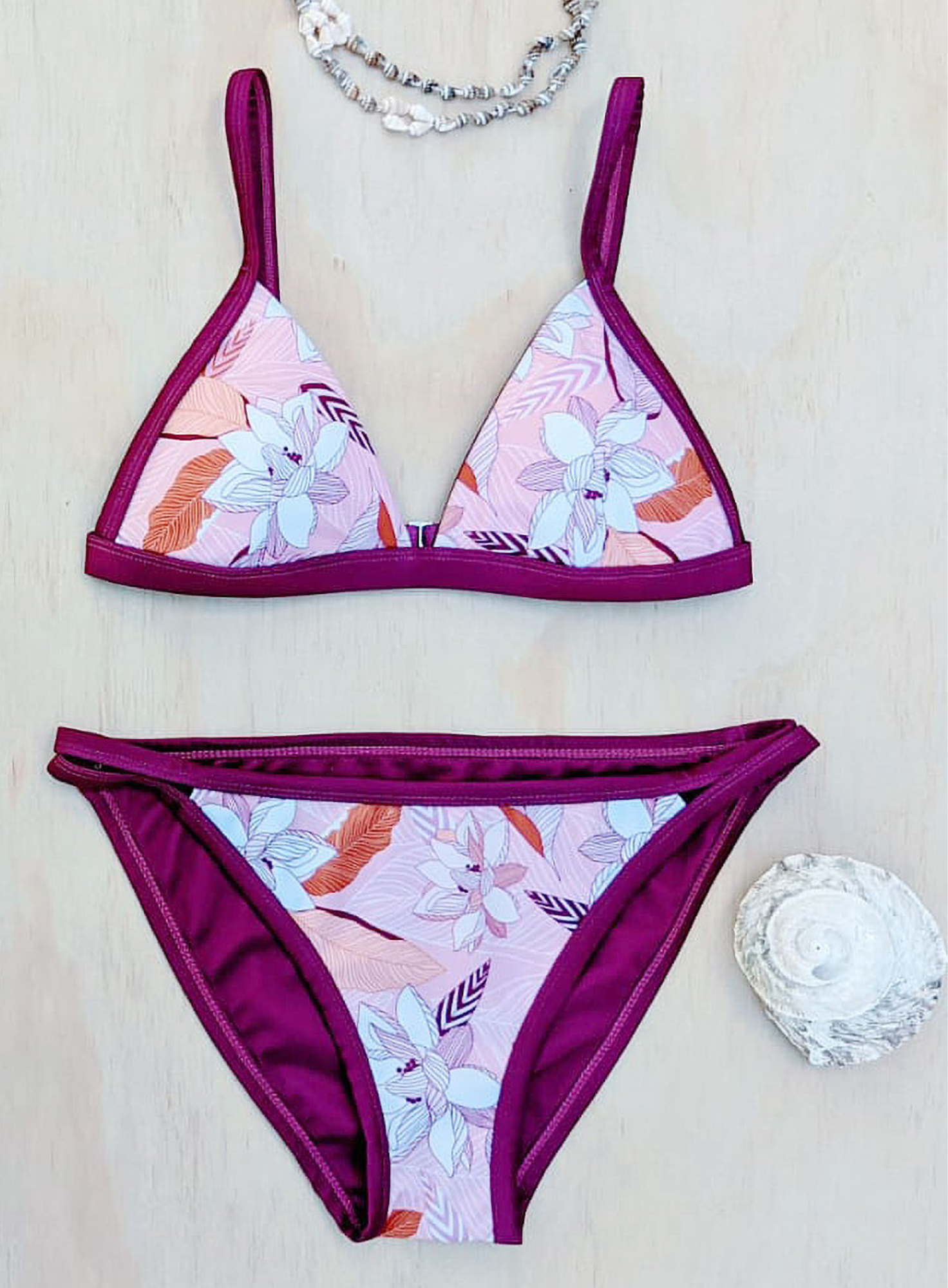 Sustainable swimwear Pink Floral Reversible Bikini Top flat lay