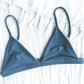 Sustainable swimwear reversible bikini top in blue and purple blue side flat lay