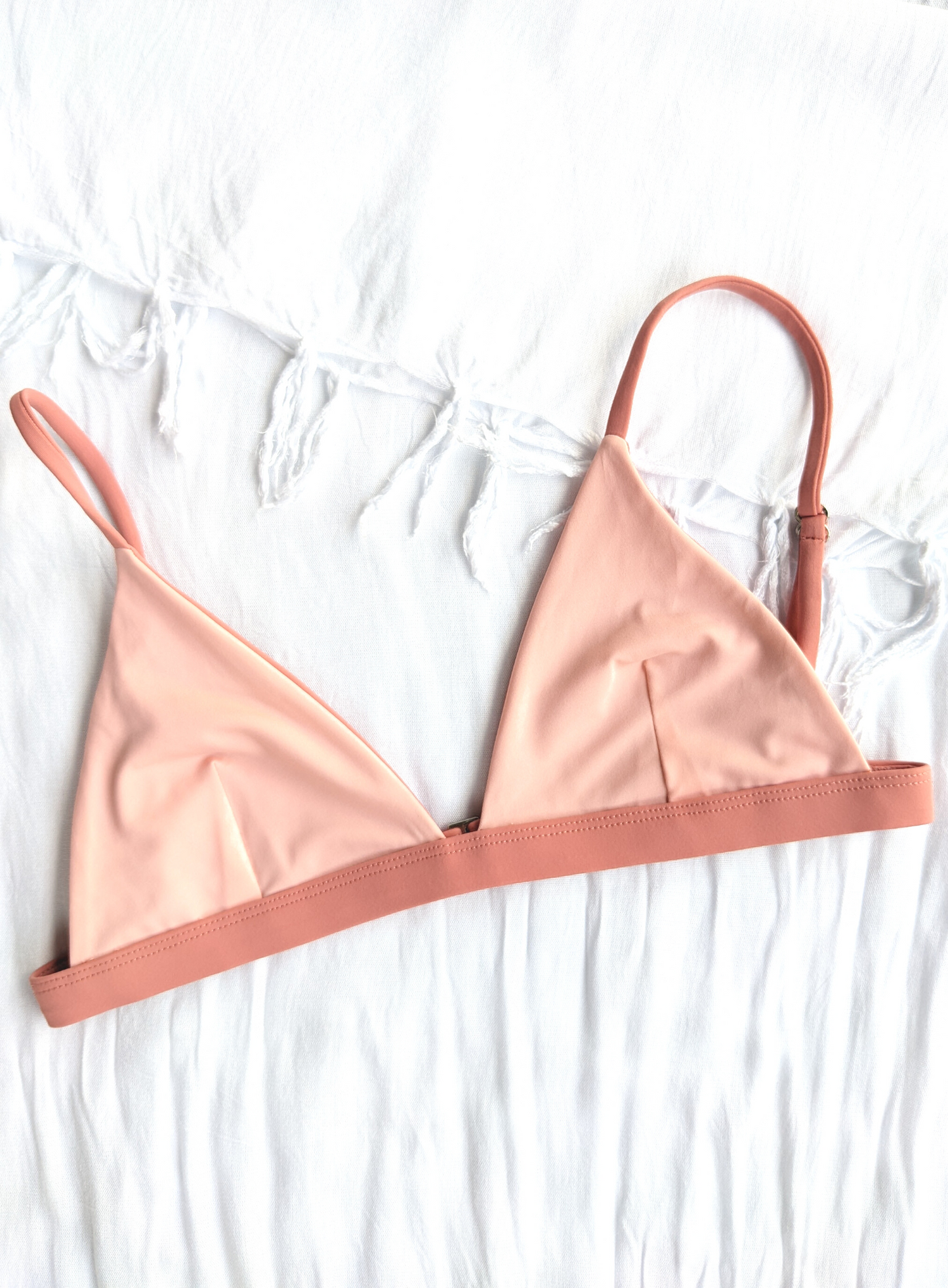 Sustainable reversible blush and peach triangle bikini top