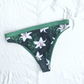 Sustainable swimwear reversible bikini green floral cheeky bikini bottom flat lay