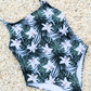 Floral print one piece swimwear made from sustainable swimwear material, flat lay