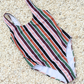 Stripe one piece swimwear made from sustainable swimwear material, flat lay