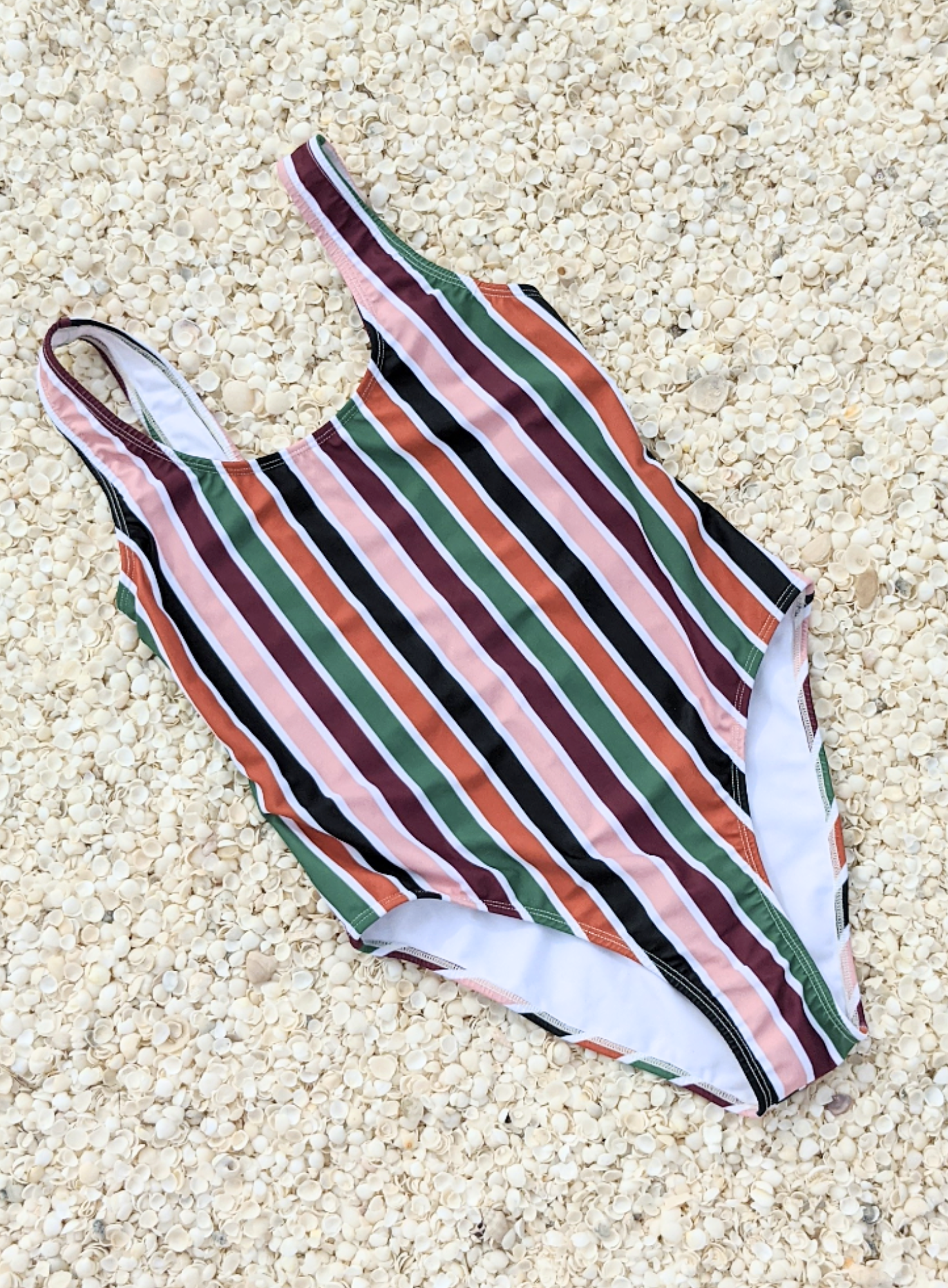 Stripe one piece swimwear made from sustainable swimwear material, flat lay