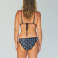 Reversible bikini, string bikini in black and white and full coverage bikini bottoms made from sustainable swimwear material