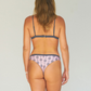 Reversible bikini, gray bikini top and cheeky bikini bottom made from sustainable swimwear material, back view